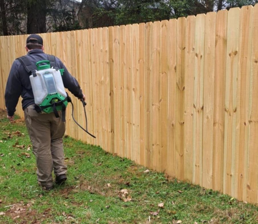 Critter Wranglers technician performing yard tick treatment