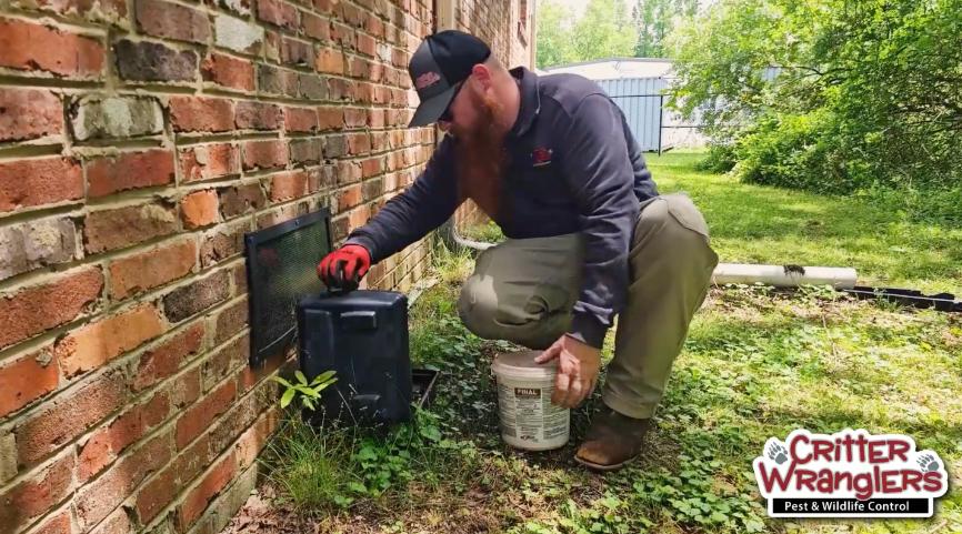 ant-control image Critter Wranglers technician with service van