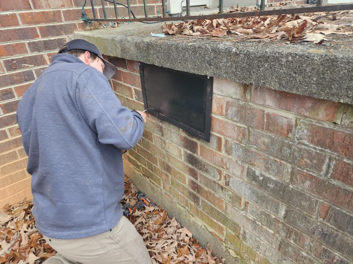 Critter Wranglers performing rodent exclusion and sealing on a home